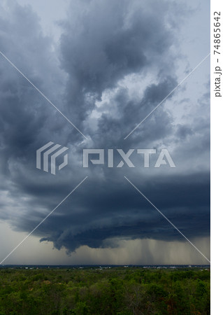 .Storm clouds with the rain. Nature Environment Dark huge cloud sky black stormy cloud .Storm clouds with the rain. Nature Environment Dark huge cloud sky black stormy cloud 74865642