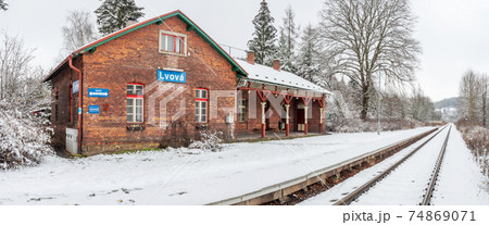 Historic single-track train station covered with fresh snow Historic single-track train station covered with fresh snow 74869071