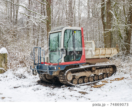 Small Dumper Tracked Truck with Muddy Chassis. The transporter waiting Small Dumper Tracked Truck with Muddy Chassis. The transporter waiting 74869073