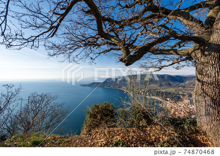 Aerial View of the Lake Garda with the Small Town of Garda - Veneto Italy Aerial View of the Lake Garda with the Small Town of Garda - Veneto Italy 74870468