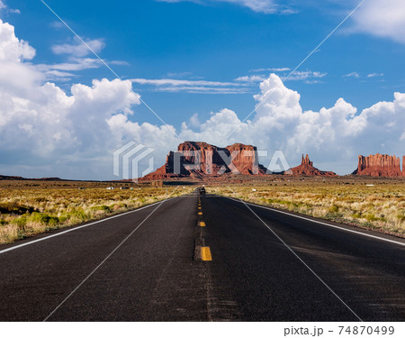 Empty scenic highway in Monument Valley Empty scenic highway in Monument Valley 74870499