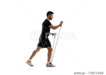 Caucasian professional sportsman training isolated on white studio background. Muscular, sportive man practicing. 74871938