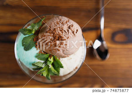 Chocolate, mint and vanilla ice-cream set in bowl 74875877