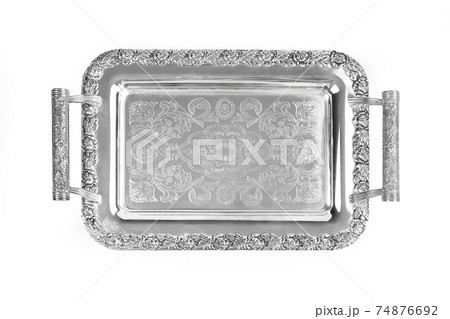 Antique silver tray with handles. Old luxury tray isolated on white background with clipping path. Closeup, top view. 74876692