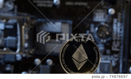 Ethereum coin on computer motherboard background, cryptocurrency mining, virtual money 74876697