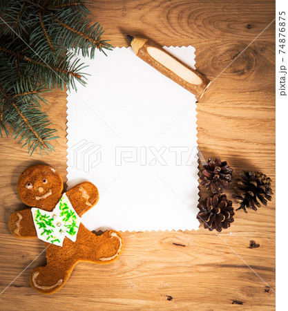 blank sheet of paper on the wooden floor with a pencil 74876875