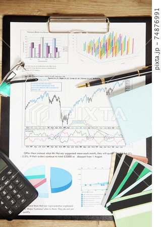 financial schedule and discount cards in the workplace of the businessman 74876991