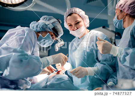 A team of surgeons is fighting for life, for a real operation, for real emotions. The intensive care team is fighting for the life of the patient. Saving life, the struggle for life A team of surgeons is fighting for life, for a real operation, for real emotions. The intensive care team is fighting for the life of the patient. Saving life, the struggle for life 74877327