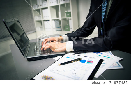 Person Typing on a modern laptop 74877485