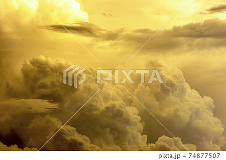 Strong rain clouds at sunset Strong rain clouds at sunset 74877507