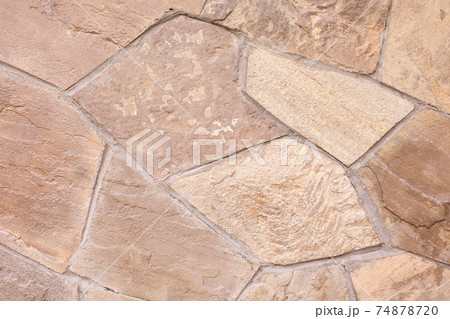 Texture of a stone wall. Beige background. Natural stone texture. Texture of a stone wall. Beige background. Natural stone texture. 74878720