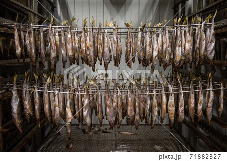 Smoked fish production concept 74882327