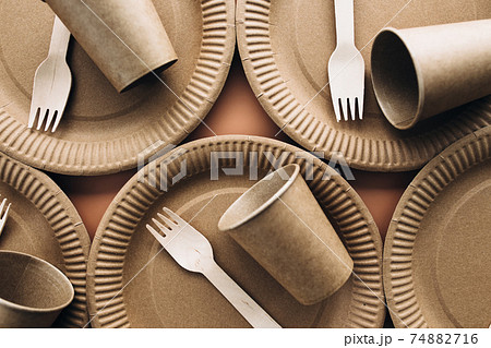 Eco-friendly kraft paper fork, cup and plate. Zero waste and recycling concept. 74882716