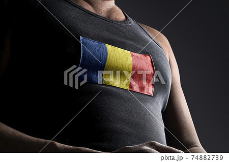 The national flag of Romania on the athlete's chest The national flag of Romania on the athlete's chest 74882739