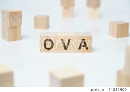 Modern business buzzword - OVA. Word on wooden blocks on a white background. 74882900