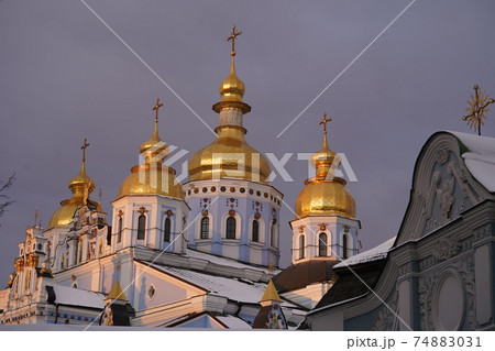 Golden domes of St. Michaels Cathedral in Kiev against the sky Golden domes of St. Michaels Cathedral in Kiev against the sky 74883031