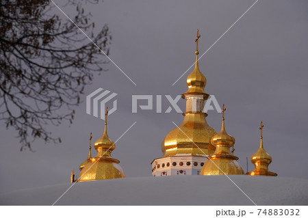 Golden domes of St. Michaels Cathedral in Kiev against the sky 74883032