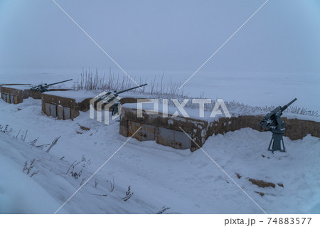 Russia. Kronstadt. February 13, 2021. Cannons from the 2nd World War of 45 mm caliber on the REEF fort in the western part of Kotlin Island. Russia. Kronstadt. February 13, 2021. Cannons from the 2nd World War of 45 mm caliber on the REEF fort in the western part of Kotlin Island. 74883577