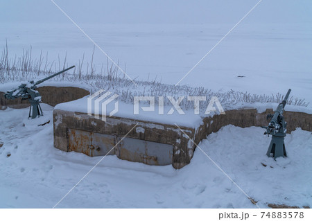 Russia. Kronstadt. February 13, 2021. Cannons from the 2nd World War of 45 mm caliber on the REEF fort in the western part of Kotlin Island. Russia. Kronstadt. February 13, 2021. Cannons from the 2nd World War of 45 mm caliber on the REEF fort in the western part of Kotlin Island. 74883578
