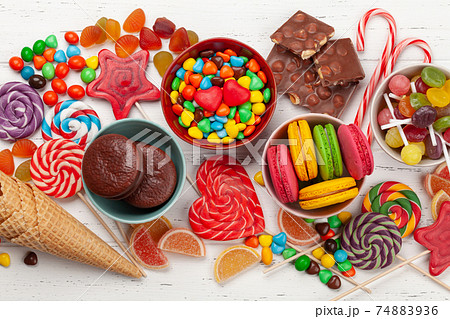 Various sweets assortment. Candy, bonbon, macaroons 74883936
