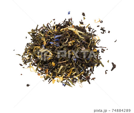 Dry tea with herbs isolated on white. Mix green tea. Dry tea with herbs isolated on white. Mix green tea. 74884289
