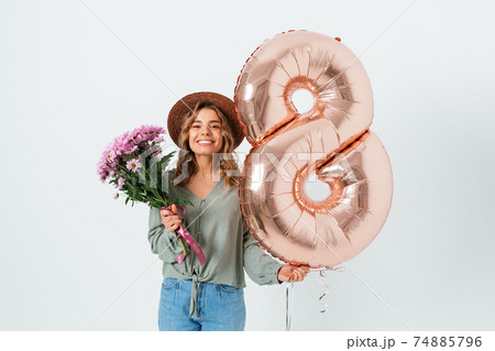 Young beautiful woman celebrating International Women's Day Young beautiful woman celebrating International Women's Day 74885796