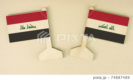 Two flags of Iraq made of cardboard on the desk, flat layout Two flags of Iraq made of cardboard on the desk, flat layout 74887489