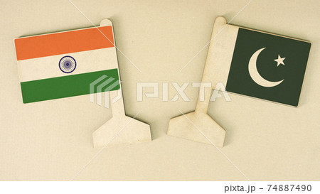 Flags of India and Pakistan made of recycled paper on the cardboard desk, flat layout Flags of India and Pakistan made of recycled paper on the cardboard desk, flat layout 74887490