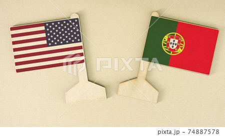 Flags of the USA and Portugal made of recycled paper on the cardboard desk, flat layout Flags of the USA and Portugal made of recycled paper on the cardboard desk, flat layout 74887578