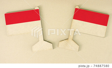Flags of Indonesia made of recycled paper on the cardboard desk, flat layout Flags of Indonesia made of recycled paper on the cardboard desk, flat layout 74887580