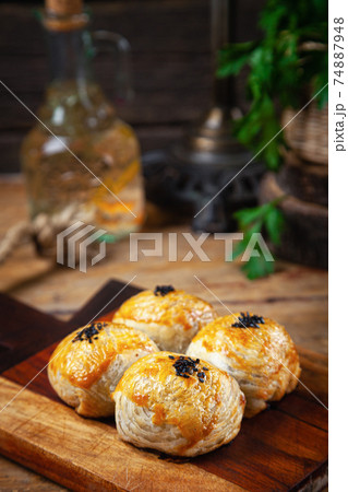 Close-up baked national asian pie samsa with meat, sesame, traditional homemade patty 74887948