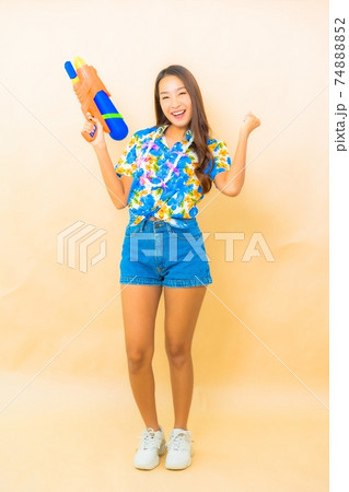 Portrait beautiful young asian wear colorful shirt for songkran festival Portrait beautiful young asian wear colorful shirt for songkran festival 74888852