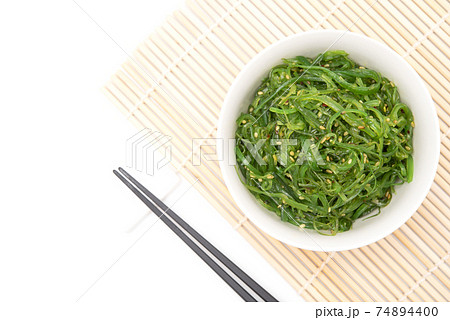 Wakame seaweed salad with sesame dressing. Traditional japanese food Wakame seaweed salad with sesame dressing. Traditional japanese food 74894400