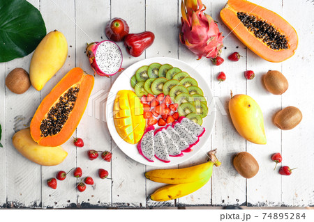 Summer tropical fruit in a plate Summer tropical fruit in a plate 74895284