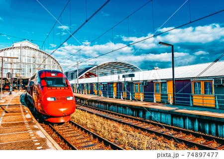 Modern Fast Passenger Train at the station. Modern Fast Passenger Train at the station. 74897477