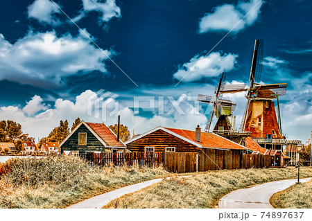 Unique old, authentic, real working windmills in the suburbs of Amsterdam, the Netherlands. Unique old, authentic, real working windmills in the suburbs of Amsterdam, the Netherlands. 74897637