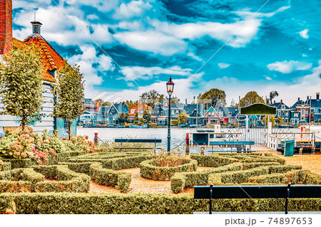 Typical, authentic village with cozy houses of the  countryside in the Netherlands. 74897653