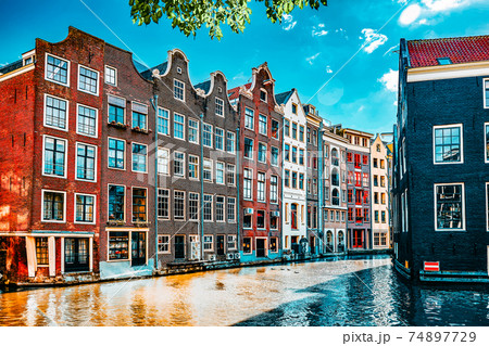 Beautiful views of the streets, ancient buildings, people, embankments of Amsterdam - also call "Venice in the North". Netherlands Beautiful views of the streets, ancient buildings, people, embankments of Amsterdam - also call "Venice in the North". Netherlands 74897729