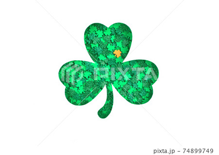 Shamrock silhouette with green confetti texture on white background 74899749