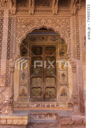 Ornate and heavy carved door of Mehrangarh Fort, Jodhpur, Rajasthan, India. 74900353