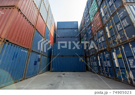 Containers box from Cargo at harbor.Foreman control Industrial Container Cargo freight ship at industry.Transportation and logistic concept. 74905023