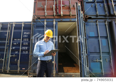 Engineer or supervisor checking and control loading Containers box from Cargo at harbor.Foreman control Industrial Container Cargo freight ship at industry.Transportation and logistic concept. Engineer or supervisor checking and control loading Containers box from Cargo at harbor.Foreman control Industrial Container Cargo freight ship at industry.Transportation and logistic concept. 74905031