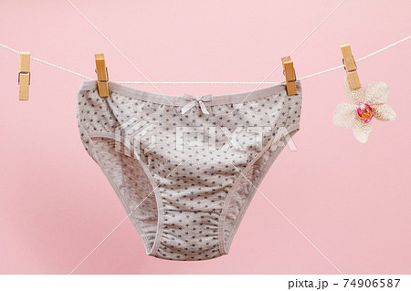 Beautiful women's cotton panties on pink background. Beautiful women's cotton panties on pink background. 74906587