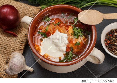 Ukrainian traditional borsch with sour cream and spices. 74907567