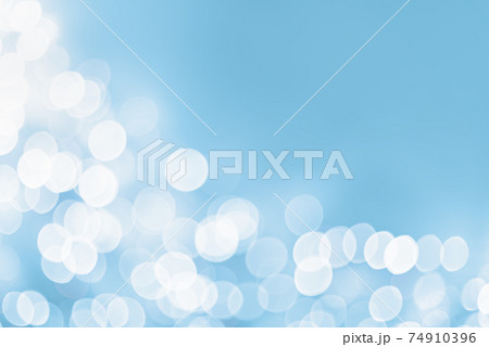 Light blue and white holiday bokeh abstract Christmas background Light blue and white holiday bokeh abstract Christmas background 74910396