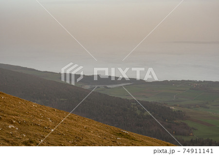 View from Swiss Jura chain over the sea of fog of Lake Biel on an autumn day 74911141