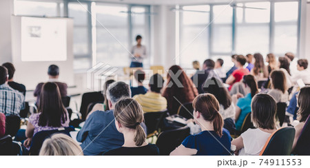 Speaker giving presentation on business conference. Speaker giving presentation on business conference. 74911553