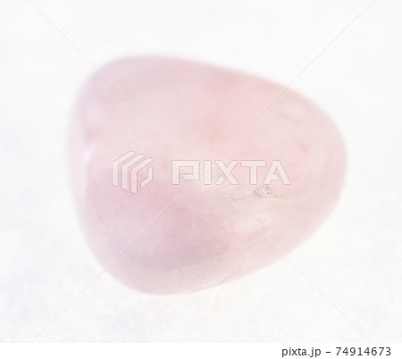 tumbled pink (rose) quartz gemstone on white 74914673