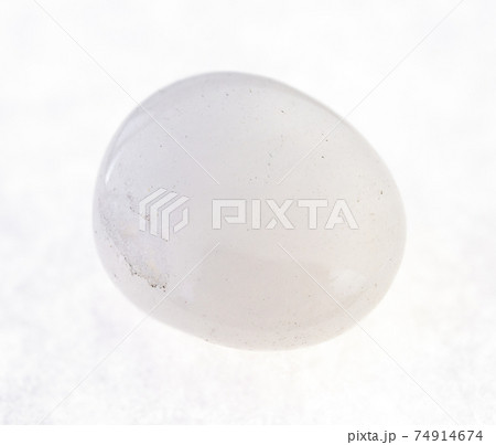 tumbled milky quartz stone on white 74914674