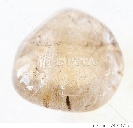 tumbled Rutilated quartz gemstone on white 74914717